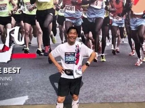 Photo of Dr. Xinjin Zhao at a marathon event
