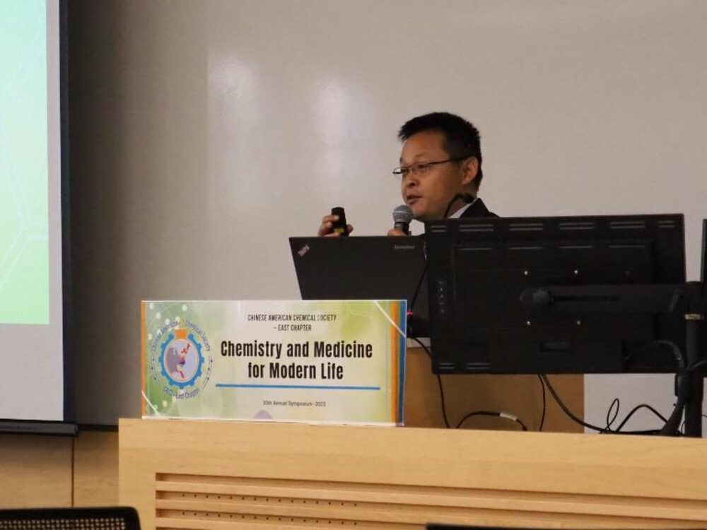 Dr. Xiaozhou Zhang, 2023 President of CACS East Chapter, delivering opening remarks at the symposium podium