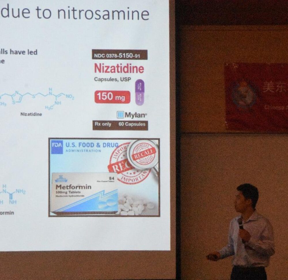 Timothy Yaroshuk presenting on N-nitrosamine quantification, with sartan-recall slides displayed