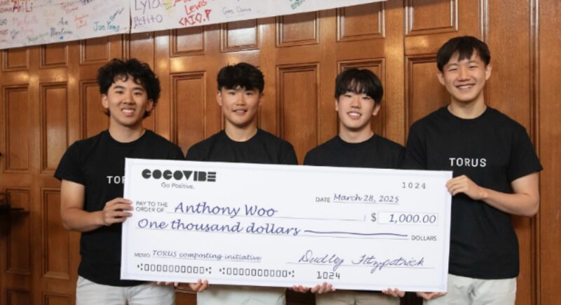 David Chen and the TORUS team holding a $1,000 award check from the West Windsor competition