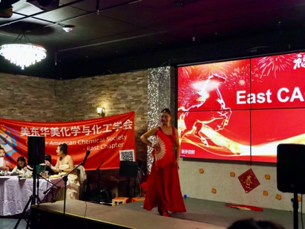 Solo dance performance in red on the gala stage
