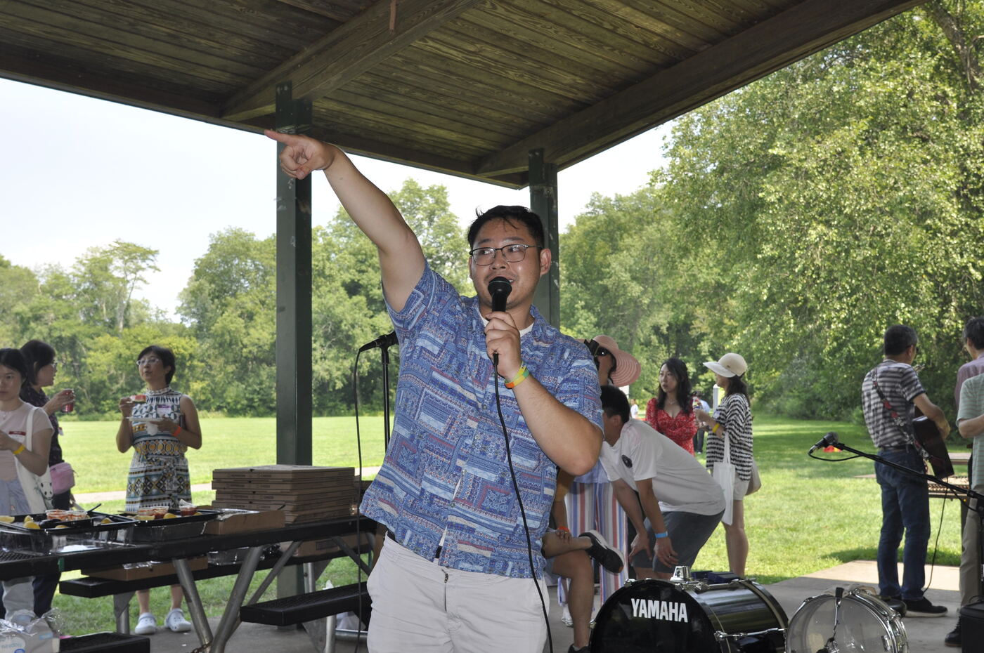 An organizer addressing the crowd with a microphone.
