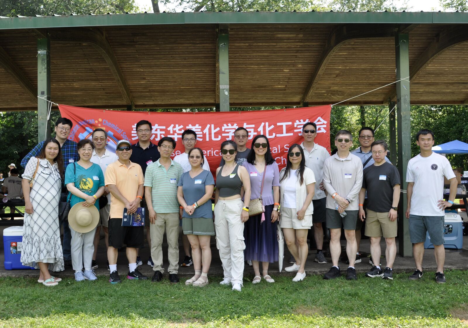 E-CACS members gathered under the pavilion in front of the chapter banner for a group photo.
