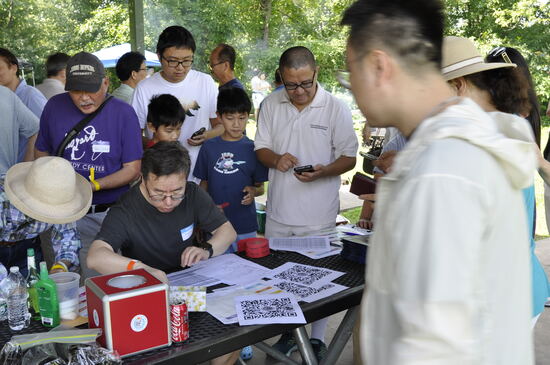 Attendees signing in at the welcome table.