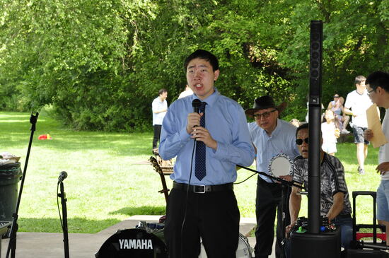 An attendee performing a song for the crowd.